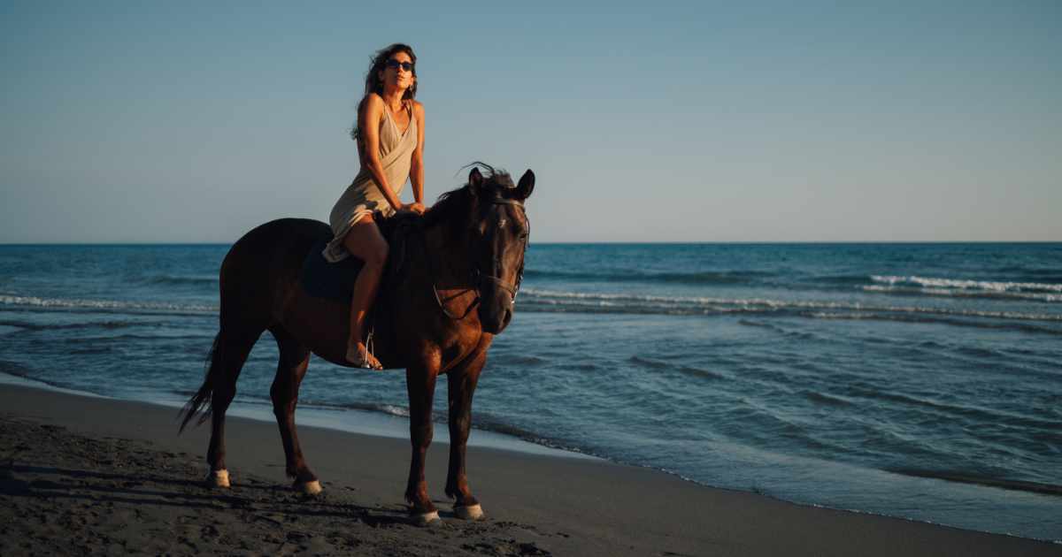 Horseback riding on a beach