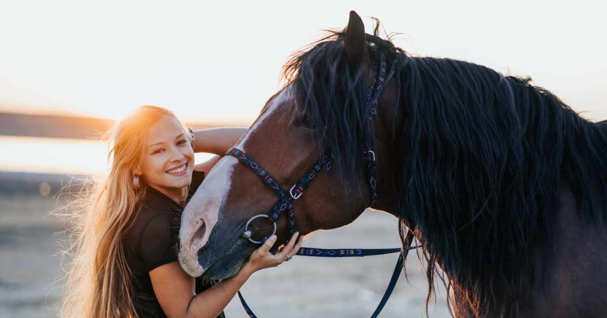 Woman hugging horse Woman hugging horse
